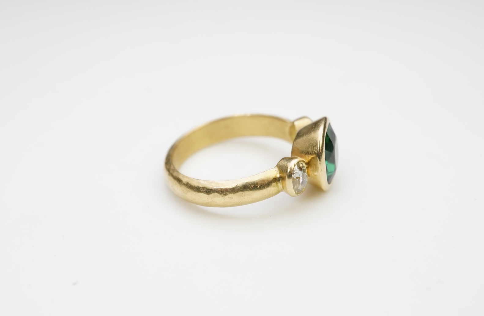 A green tourmaline and diamond ring